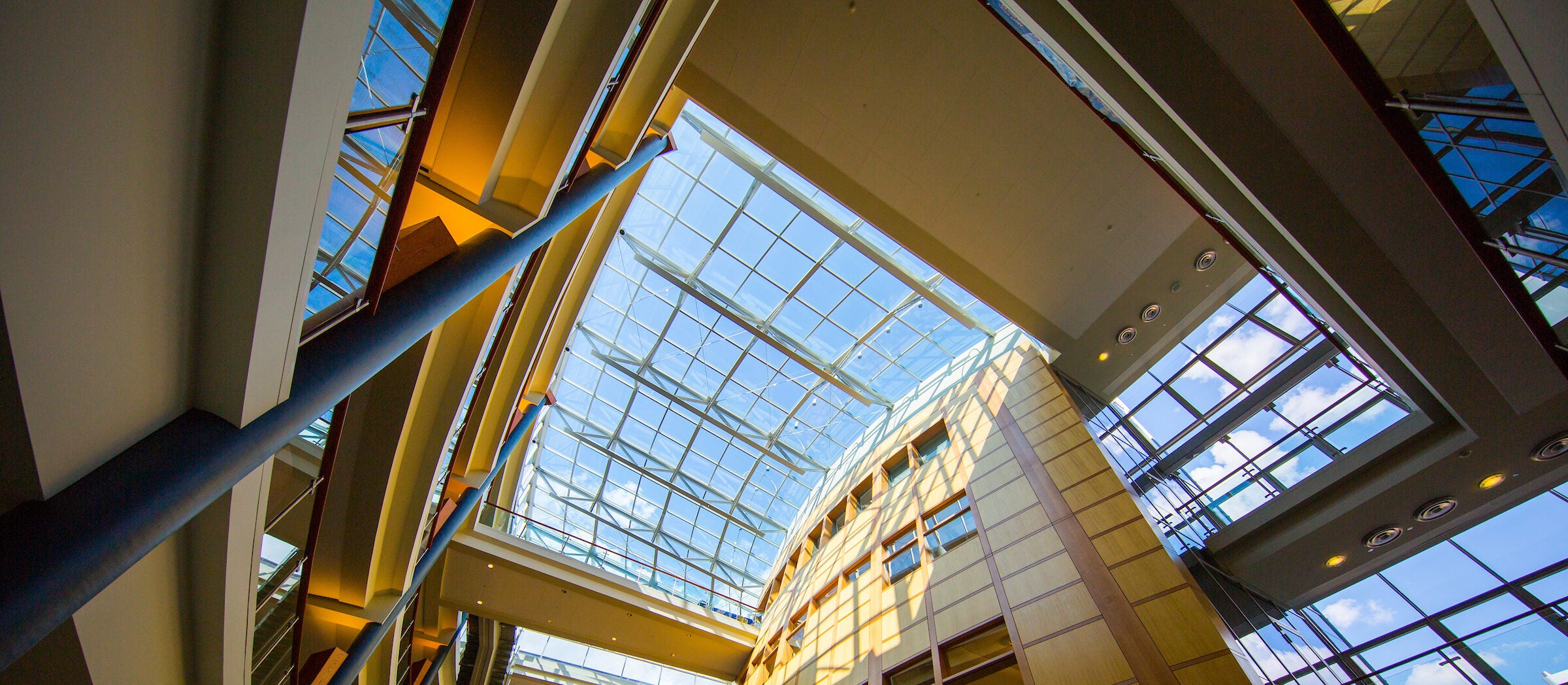 Looking up at glass window ceiling inside the McDonough School of Business